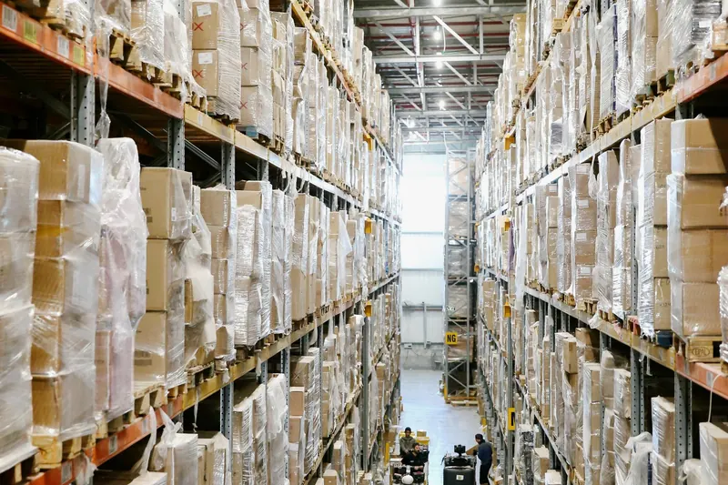 Warehouse aisle lined with racking.